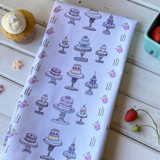 100% cotton, eco-friendly tea towel / kitchen towel with cute, hand drawn cakes and cupcakes pattern